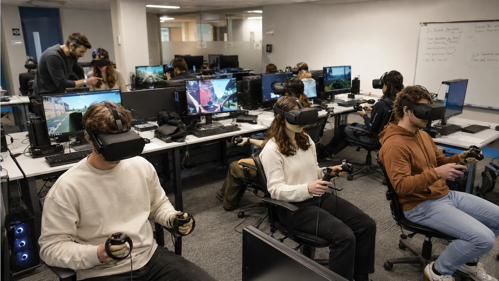 Students in VR headsets running immersive iXR modules in a university VR lab
